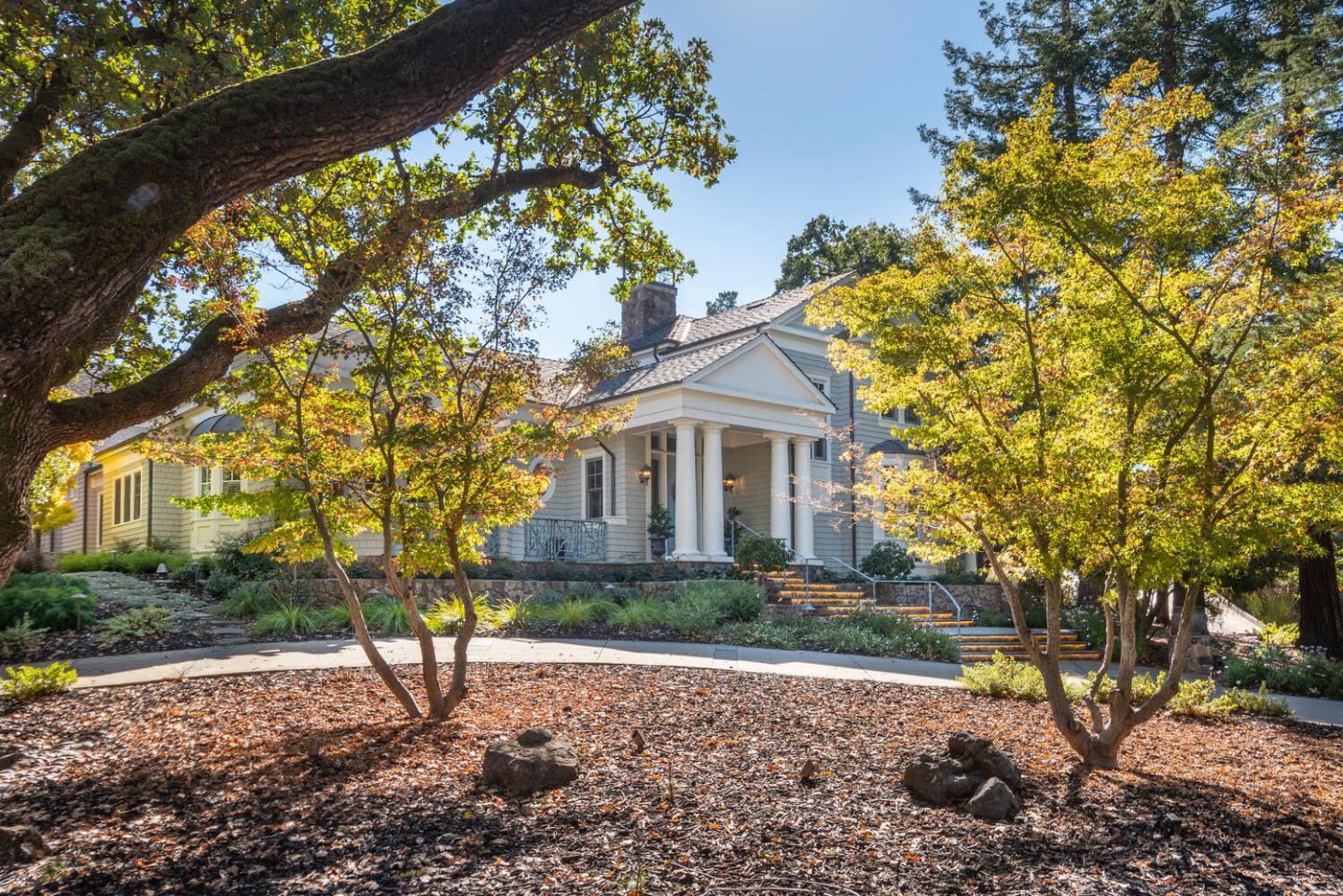 209 Bridge Road Hillsborough, CA 94010 - Photo 4 of 38 a front view of a house with a yard