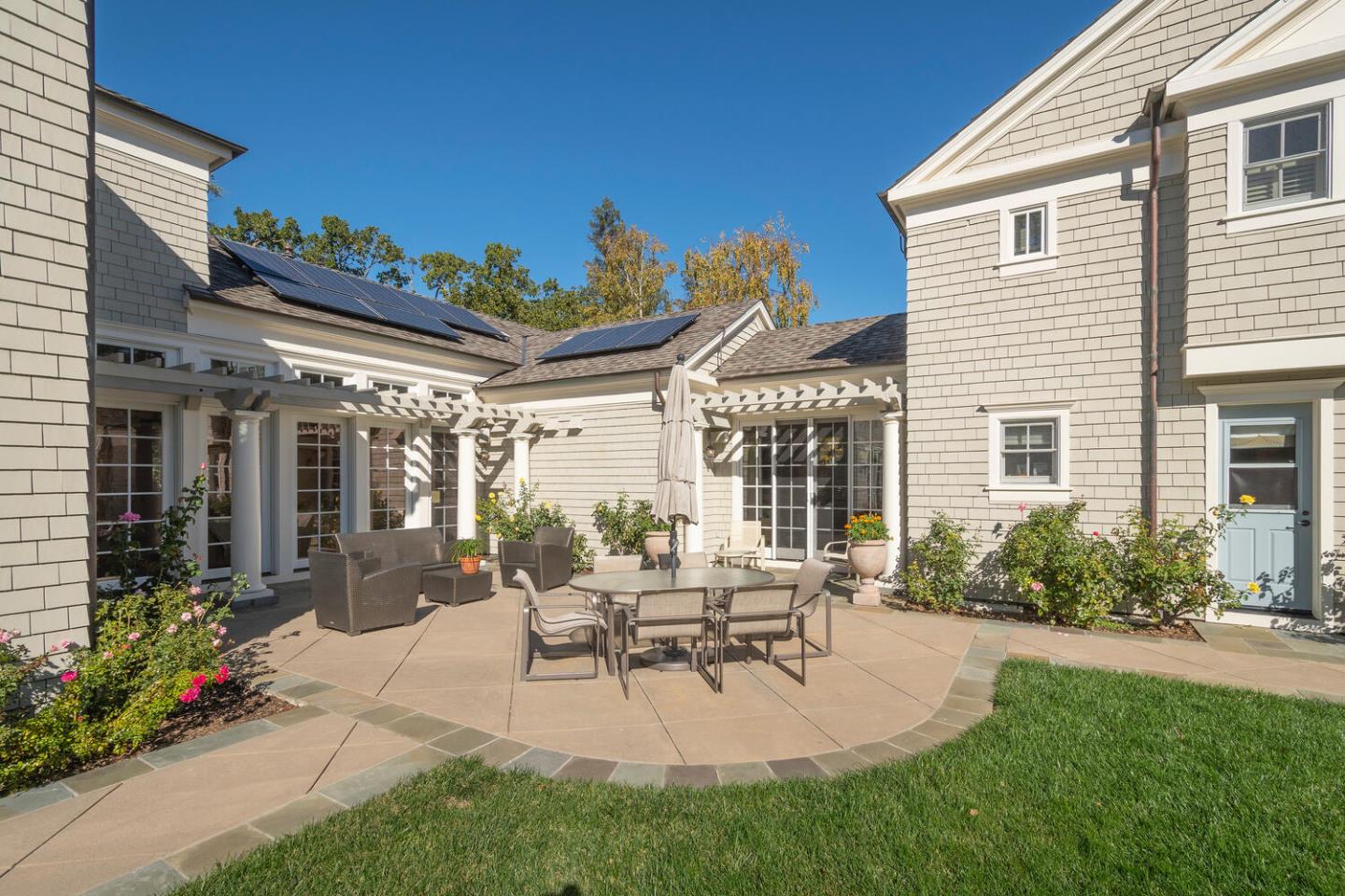 209 Bridge Road Hillsborough, CA 94010 - Photo 32 of 38 a building outdoor space with patio furniture and potted plants