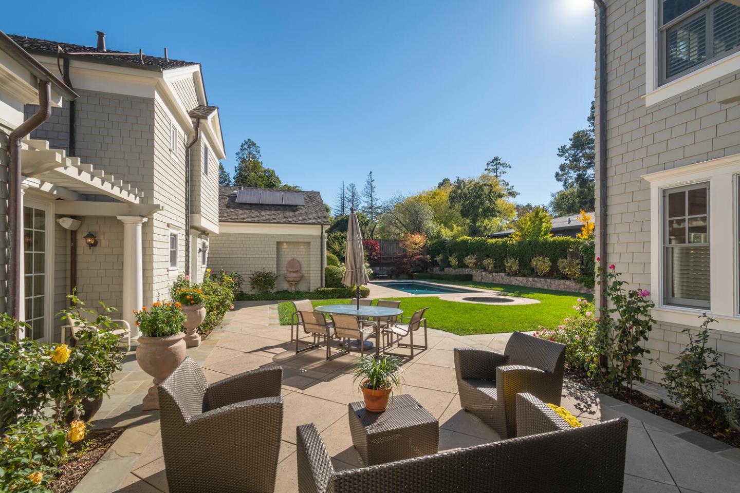 209 Bridge Road Hillsborough, CA 94010 - Photo 36 of 38 a view of a patio with couches table and chairs and potted plants