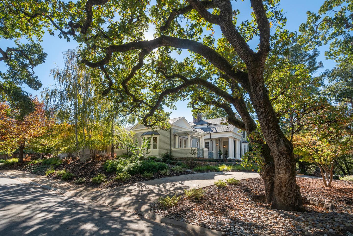 209 Bridge Road Hillsborough, CA 94010 - Photo 5 of 38 a front view of a house with a tree