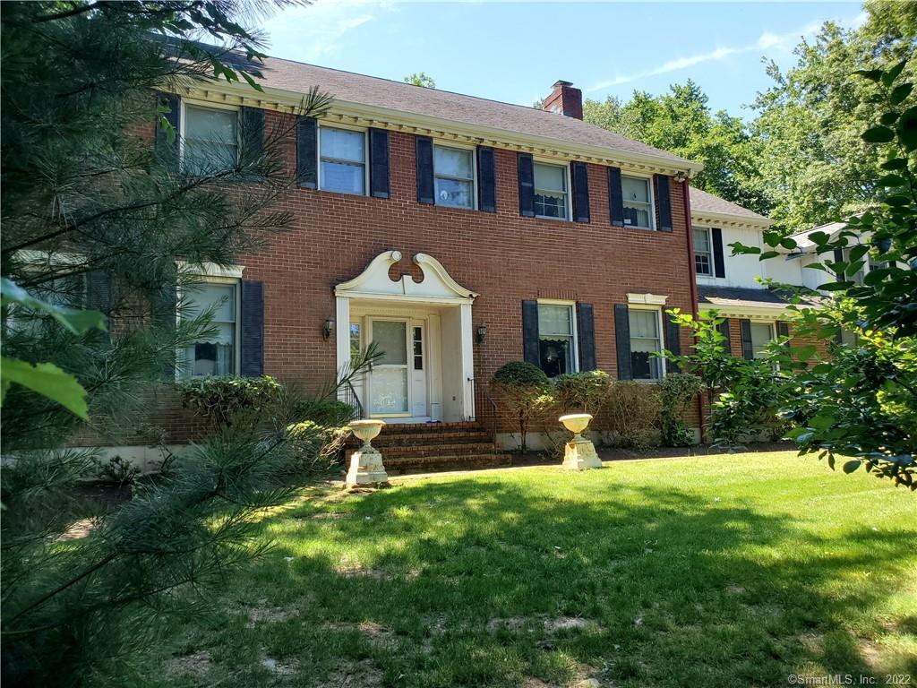 130 Wildrose Road Orange, CT 06477 - Photo 1 of 1 a front view of a house with garden