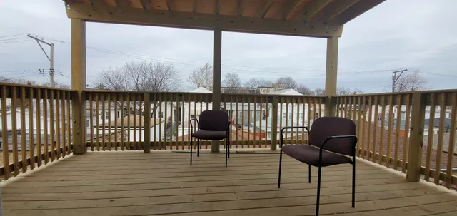 a view of a chairs on the roof deck