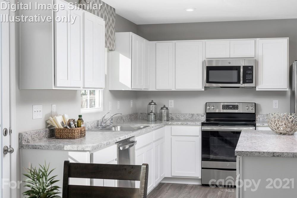5129 Tinker Field Road, Unit 2020 Charlotte, NC 28215 - Photo 3 of 14 a kitchen with stainless steel appliances granite countertop white cabinets a stove a microwave and a sink
