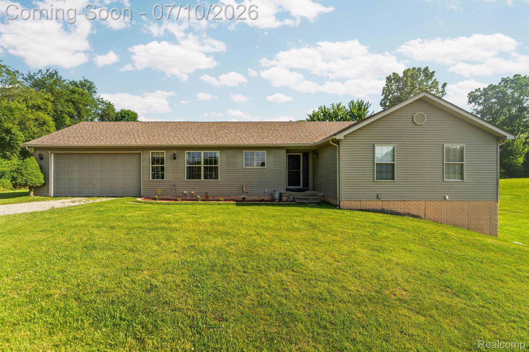 3144 North Nicholson Road Fowlerville, MI 48836 - Photo 20 of 70 Ranch-style residence featuring light-colored siding and a brown shingle roof