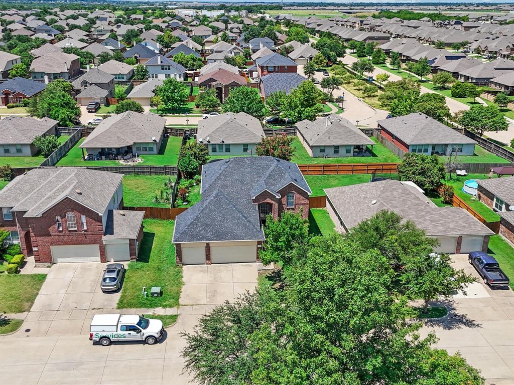 2009 Cooper Ridge Lane Heartland, TX 75126 - Photo 29 of 40 an aerial view of multiple houses with yard