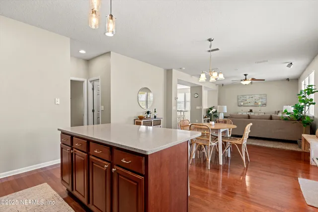 a view of a dining room with furniture and wooden floor