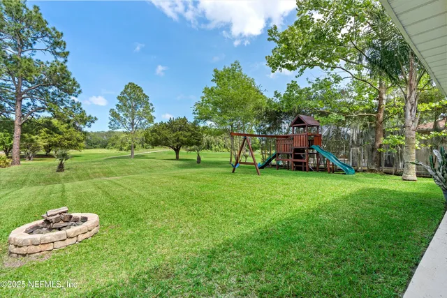 a view of a park with large trees