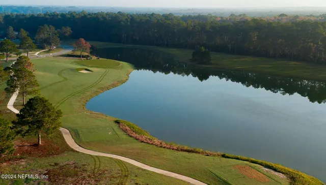 a view of a swimming pool with a yard
