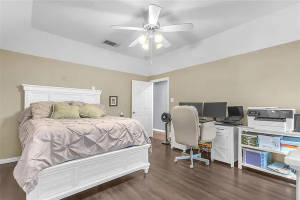 a bedroom with a bed and a chair