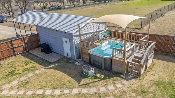 a view of a backyard with sitting area
