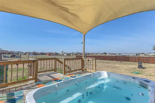 a view of a lake with couches chairs