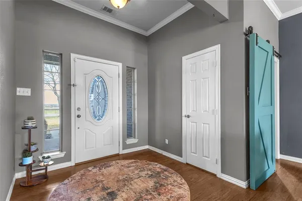 a view of a hallway with bathroom