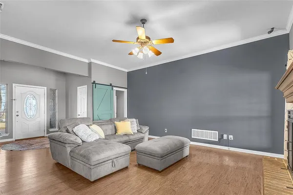 a living room with furniture and a window