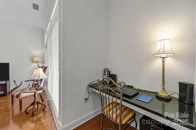 a view of a workspace with furniture