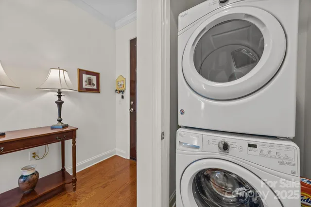 a view of a hallway with washer and dryer