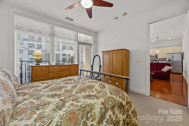 a bed room with a bed and a large window