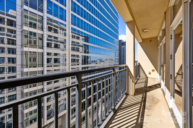 a view of a balcony with wooden floor and stairs