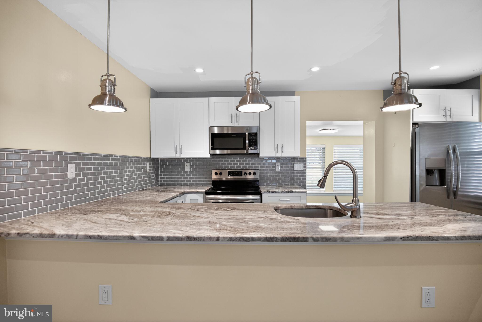 2646 Jenkintown Road Glenside, PA 19038 - Photo 14 of 29 Breakfast bar with pendant lighting