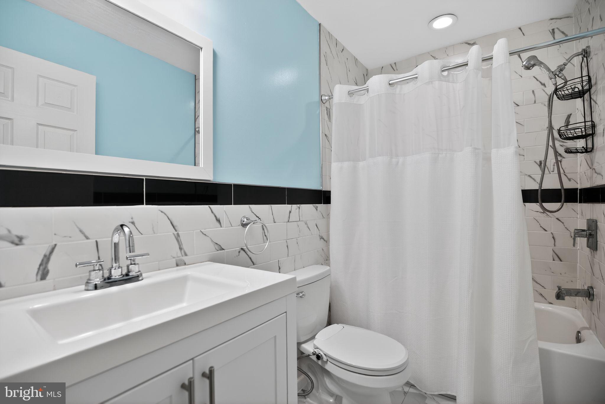 2646 Jenkintown Road Glenside, PA 19038 - Photo 23 of 29 Hall bath w/ tile floor and walls