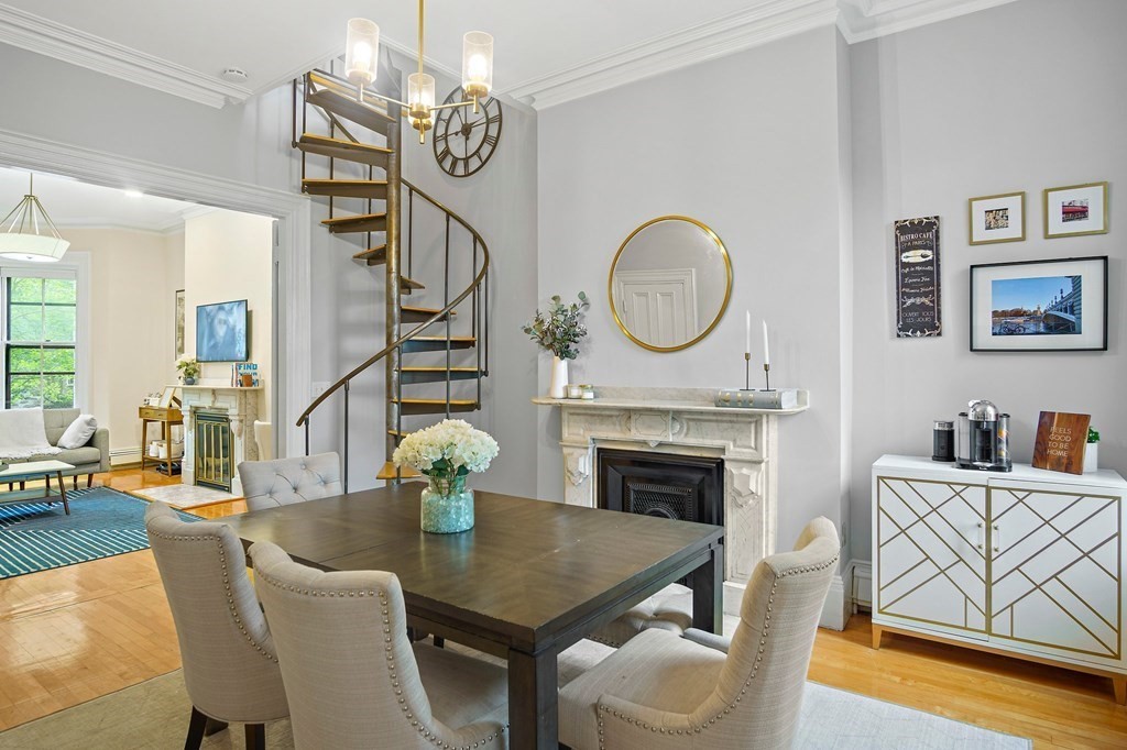 28 Everett Street, Unit 2 Boston, MA 02130 - Photo 11 of 25 a dining room with furniture a fireplace and wooden floor