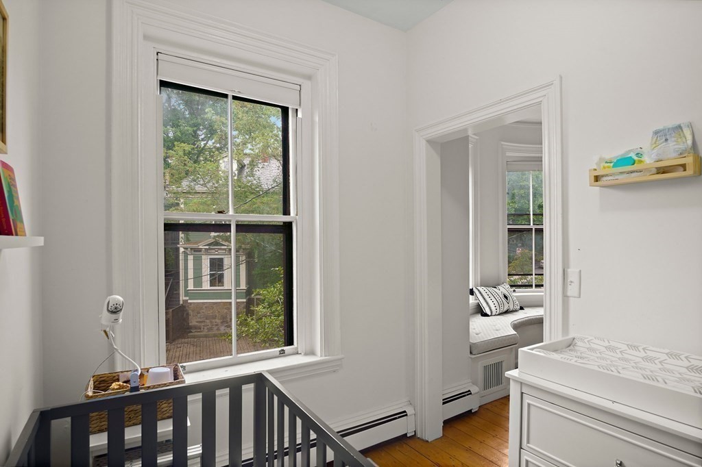 28 Everett Street, Unit 2 Boston, MA 02130 - Photo 18 of 25 a living room with furniture and a window