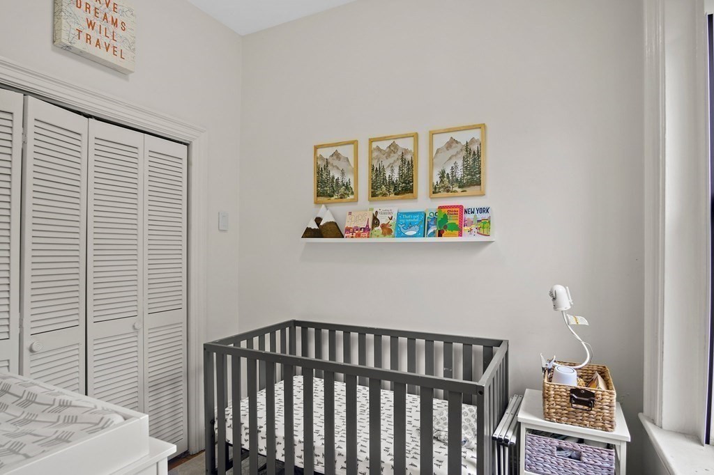 28 Everett Street, Unit 2 Boston, MA 02130 - Photo 19 of 25 a bedroom with a bed and a window