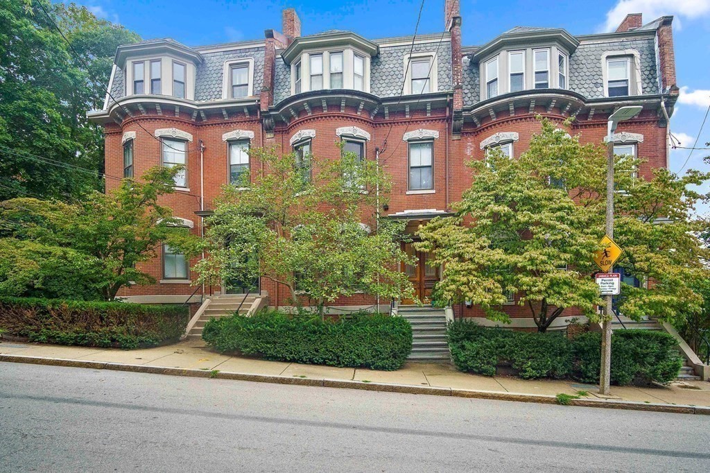 28 Everett Street, Unit 2 Boston, MA 02130 - Photo 2 of 25 front view of a brick house with a small yard