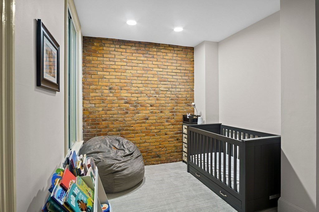 28 Everett Street, Unit 2 Boston, MA 02130 - Photo 22 of 25 a bedroom with a bed and a window