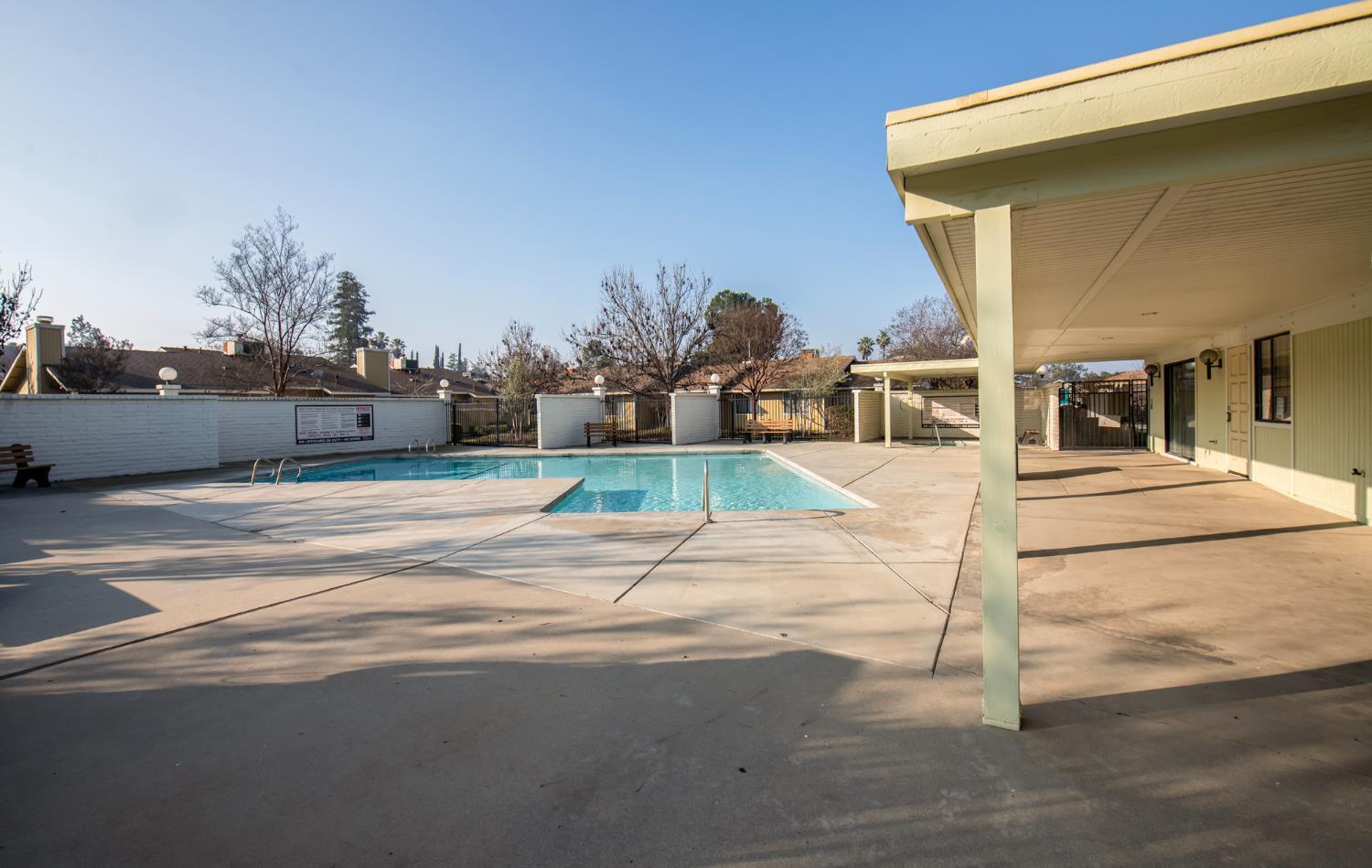 4875 North Backer Avenue, Unit 141 Fresno, CA 93726 - Photo 20 of 23 a view of a swimming pool with an outdoor seating