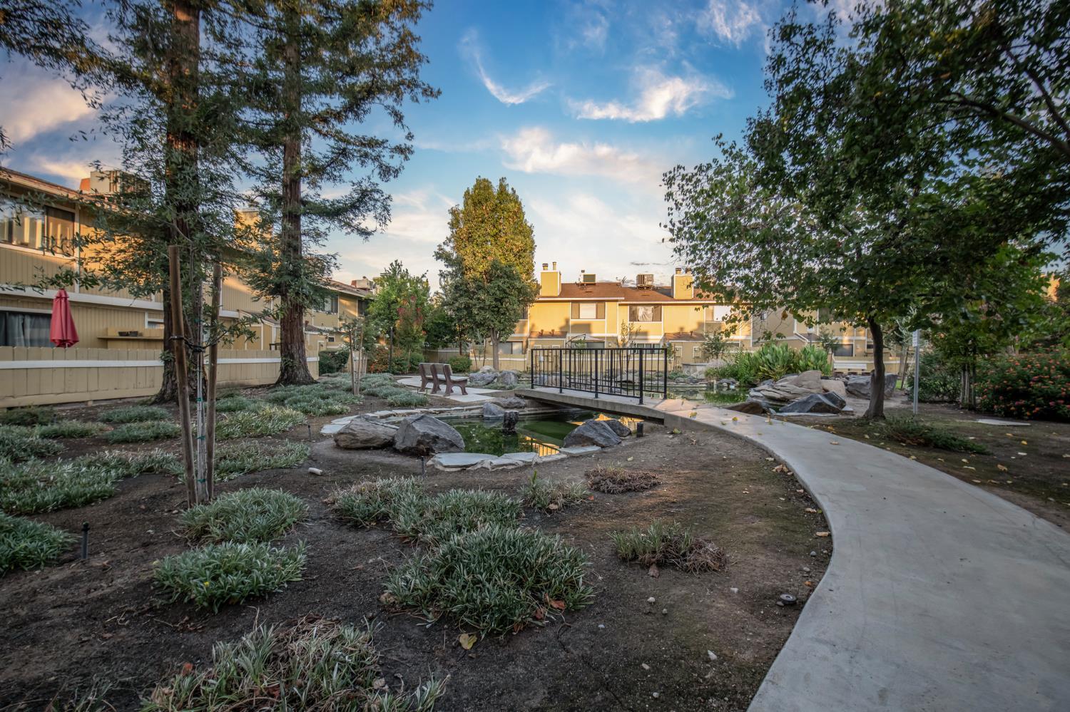 4875 North Backer Avenue, Unit 141 Fresno, CA 93726 - Photo 21 of 23 a view of a park with large trees