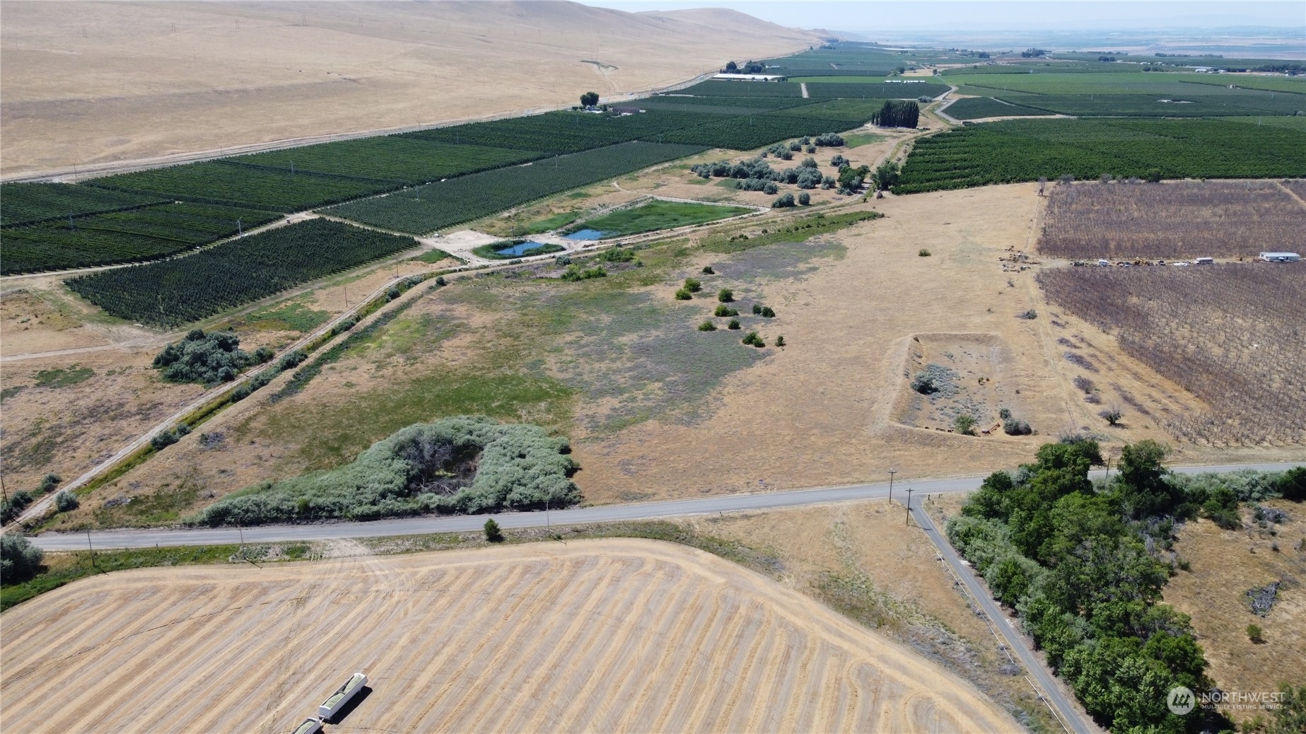 8888 South Schaake Road Othello, WA 99344 - Photo 4 of 4 an aerial view of a house with a yard