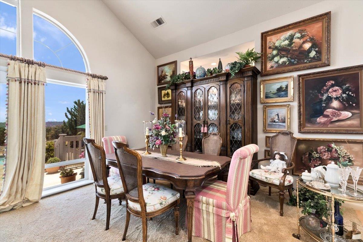 4558 Country View Court Cool, CA 95614 - Photo 11 of 82 a view of a dining room with furniture and chandelier