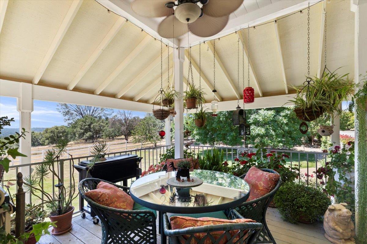 4558 Country View Court Cool, CA 95614 - Photo 14 of 82 a outdoor dining space with furniture and outdoor view