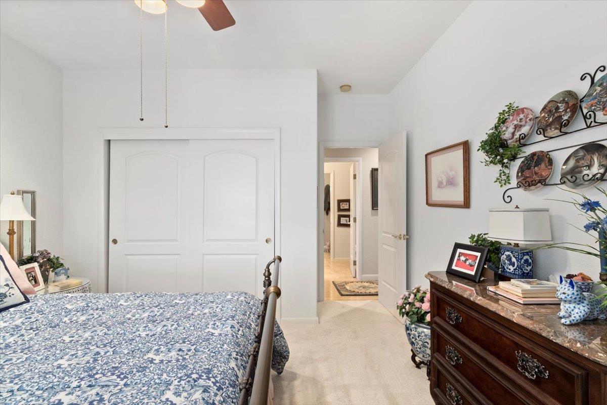 4558 Country View Court Cool, CA 95614 - Photo 15 of 82 a bedroom with a bed and a dresser in it