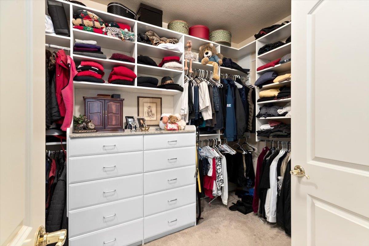 4558 Country View Court Cool, CA 95614 - Photo 16 of 82 a view of walk in closet with clothes and shoes