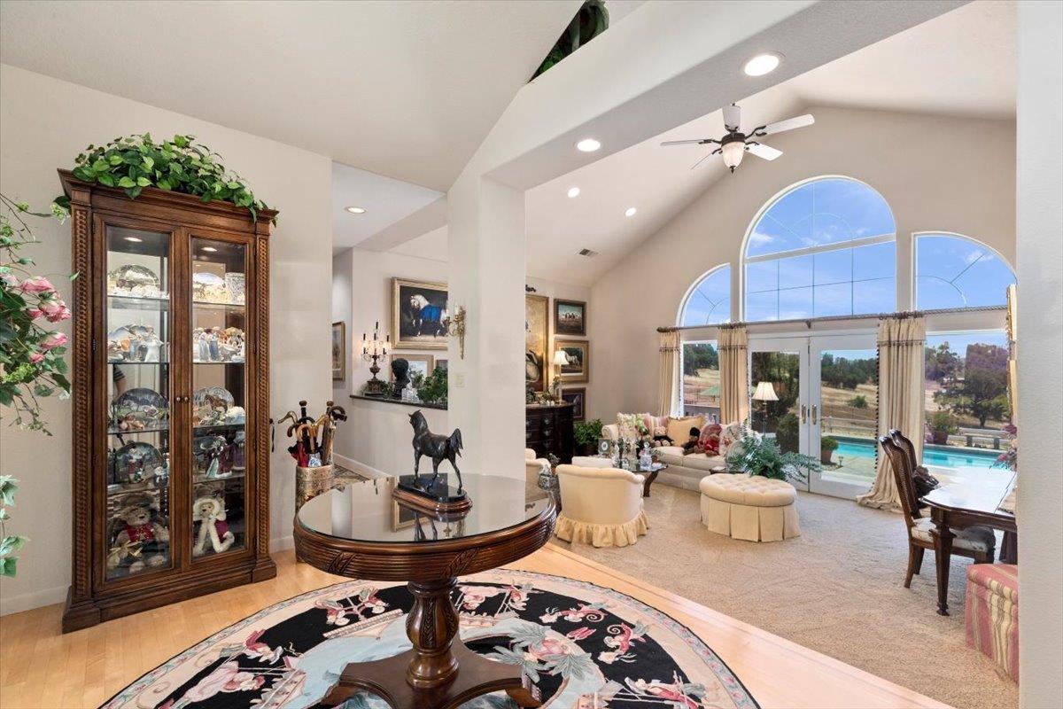 4558 Country View Court Cool, CA 95614 - Photo 19 of 82 a living room with furniture and a chandelier