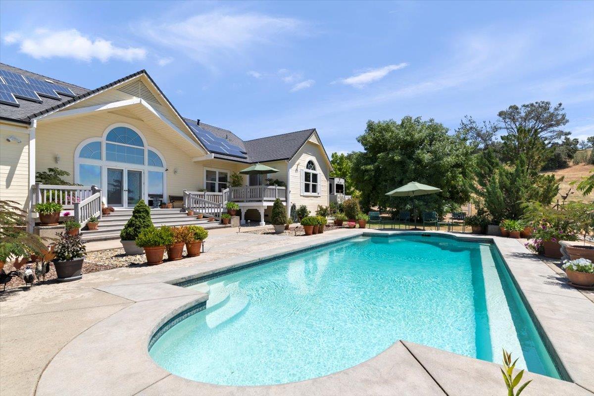 4558 Country View Court Cool, CA 95614 - Photo 58 of 82 a view of a house with swimming pool and sitting area