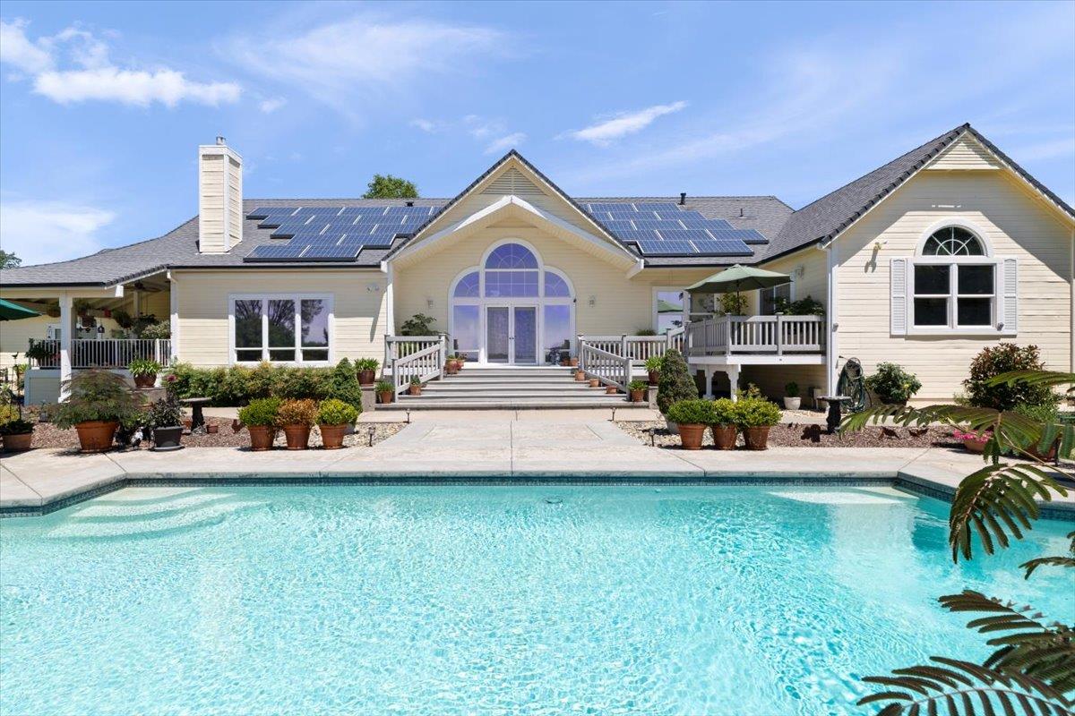 4558 Country View Court Cool, CA 95614 - Photo 60 of 82 a front view of a house with swimming pool having outdoor seating