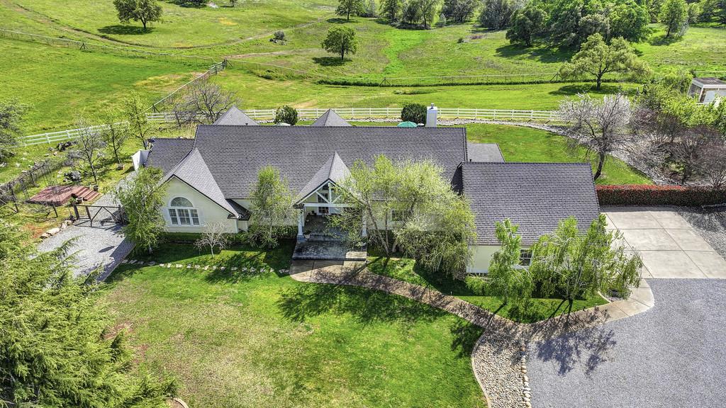 4558 Country View Court Cool, CA 95614 - Photo 62 of 82 a view of a garden with a bench