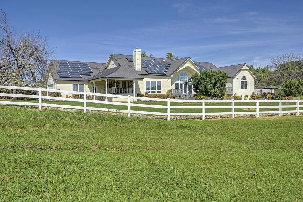 4558 Country View Court Cool, CA 95614 - Photo 77 of 82 a view of a house with a big yard and plants