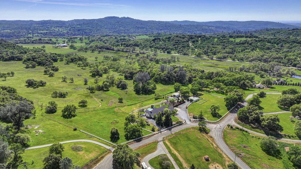 4558 Country View Court Cool, CA 95614 - Photo 80 of 82 a view of a lush green hillside and a houses
