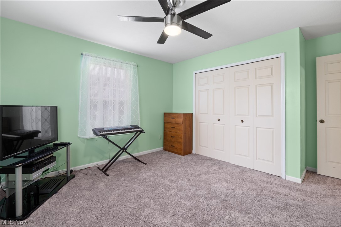 1110 Spring Road Cleveland, OH 44109 - Photo 20 of 33 Unfurnished bedroom with ceiling fan, a closet, and light colored carpet