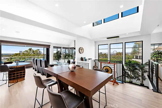 a view of a chairs and table in a patio with a yard
