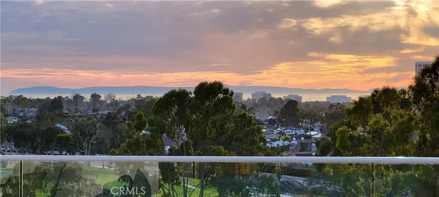 a living room with furniture fireplace and potted plants