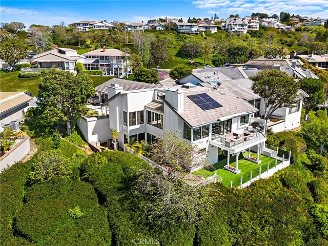 a view of a roof deck with wooden floor and fence