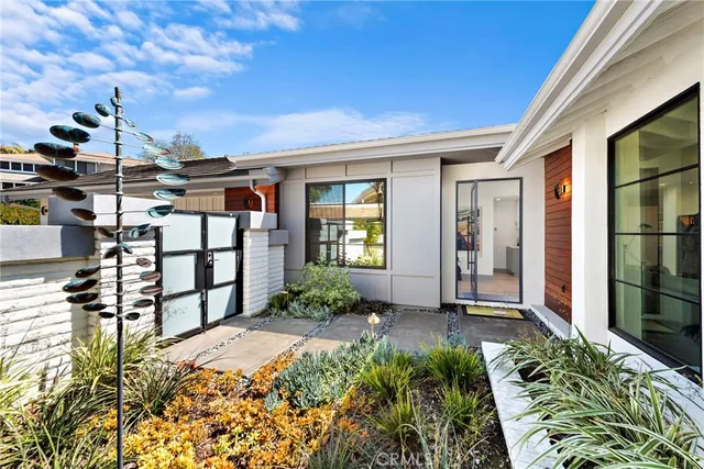 a dining hall with stainless steel appliances a table and chairs