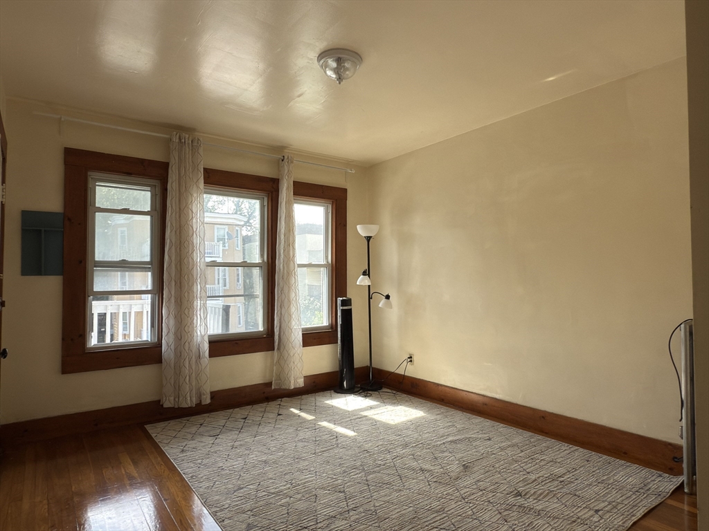 3965 Washington Street Boston, MA 02131 - Photo 3 of 18 an empty room with windows