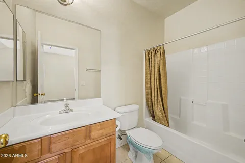 a view of washer and dryer with kitchen in the background