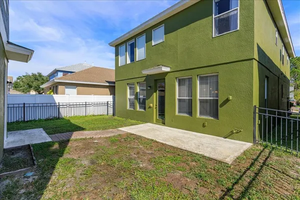 a view of a house with a backyard