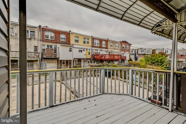 a view of a balcony with furniture